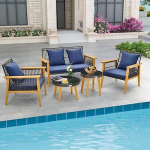 7-Piece Wood Patio Conversation Set Rattan Woven Chair Set with 2 Coffee Tables and 2 Ottomans and Navy Cushions