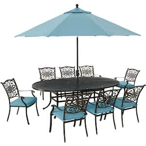 Traditions 9-Piece Aluminum Outdoor Dining Set with Blue Cushions, 8 Chairs, Oval Cast-Top Table, Umbrella and Stand