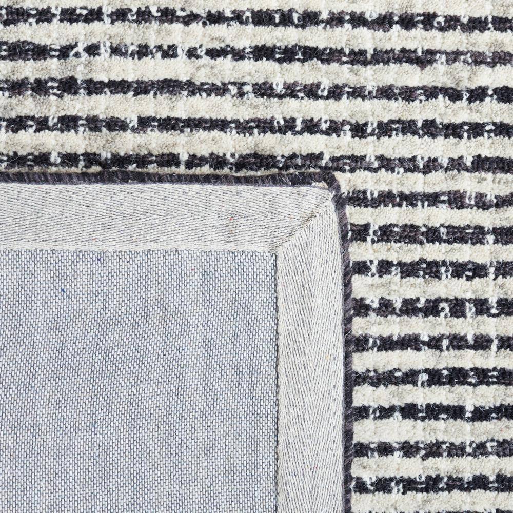 Handmade Black and Ivory Abstract Wool Area Rug, 5' x 8'