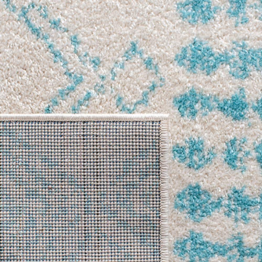 Ivory and Turquoise Moroccan Geometric 8' x 10' Area Rug