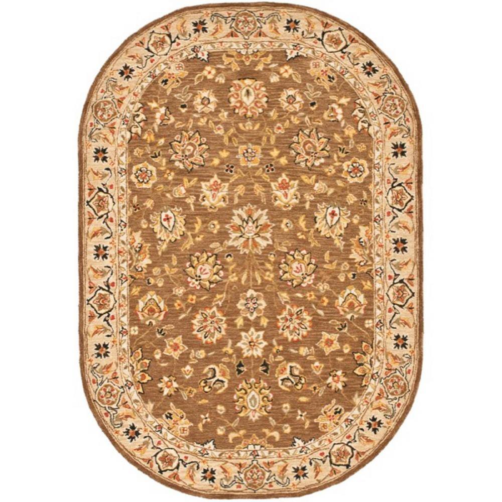 SAFAVIEH Chelsea Brown/Ivory 5 ft. x 7 ft. Oval Border Area Rug 100% pure virgin wool pile, hand-hooked to a durable cotton backing. American Country and turn-of-the-century European designs. This collection is handmade in China exclusively for Safavieh. This is a great addition to your home whether in the country side or busy city. Color: Brown/Ivory.