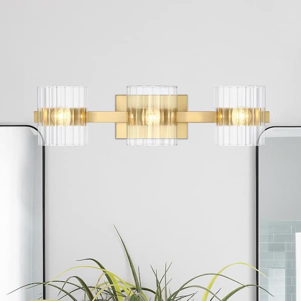 Aries 24.25 in. 3-Light Brushed Gold Modern Vanity Light with Ribbed Glass Shades