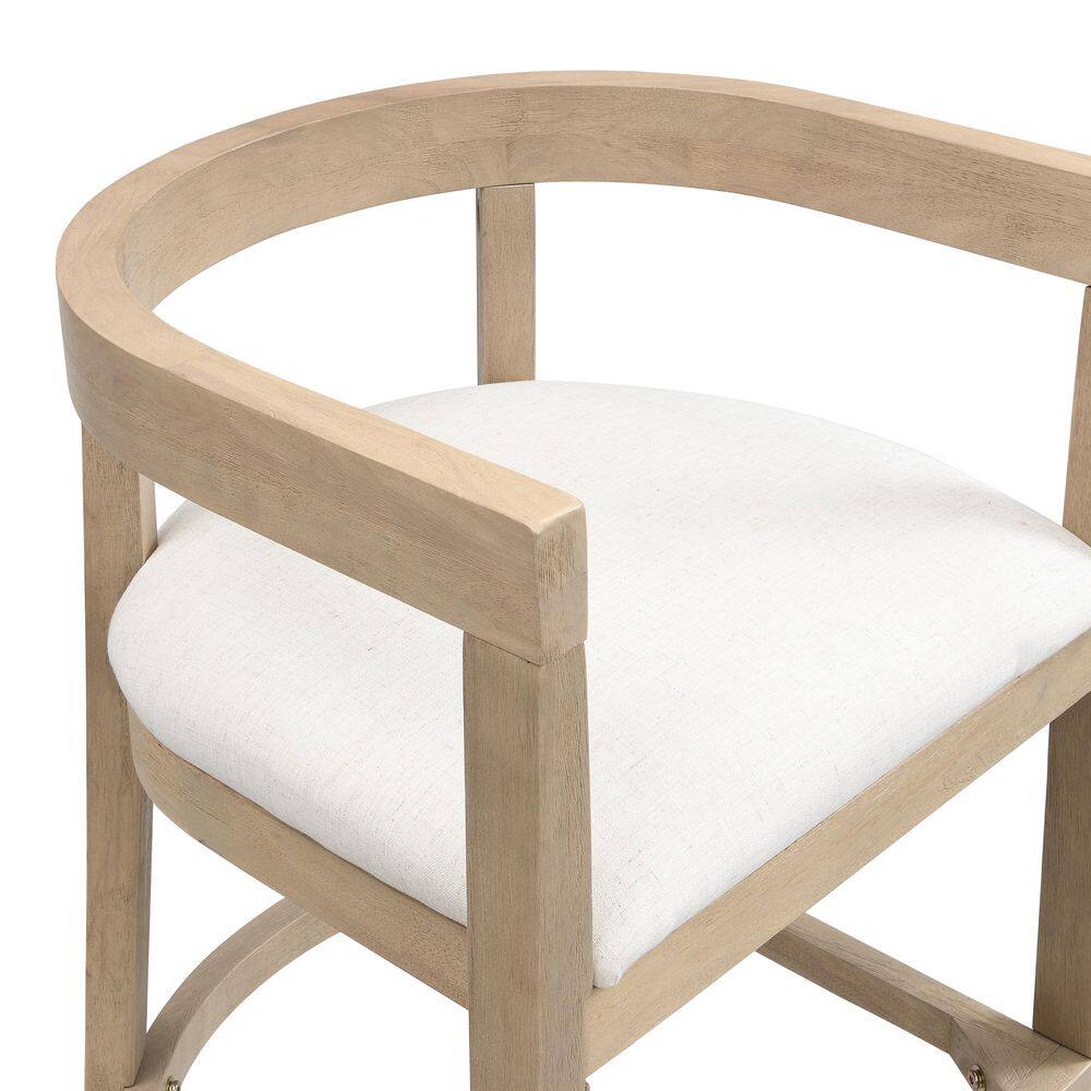 Close-up of the curved backrest and beige upholstered seat of a bar stool.