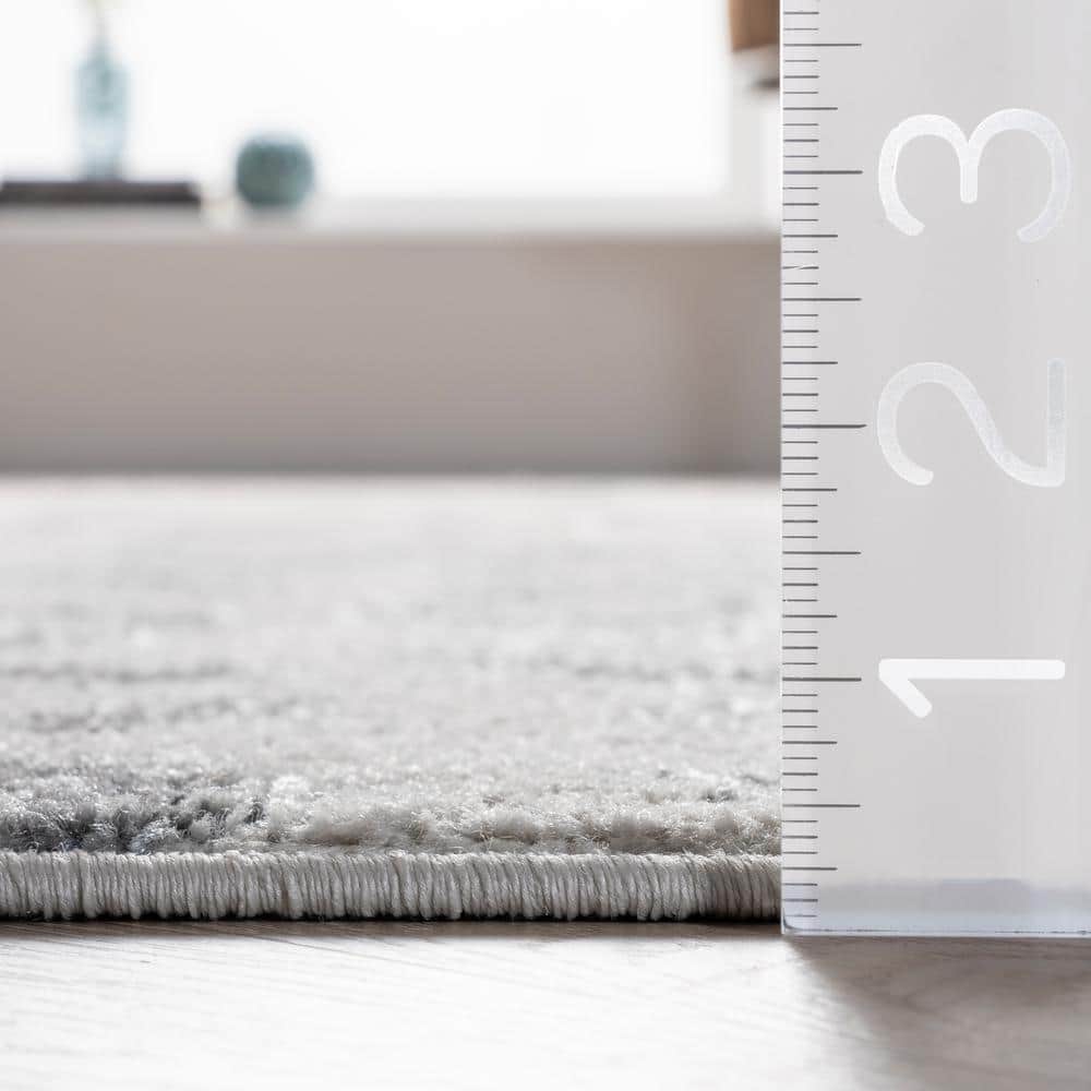 Gray Leopard Print Tufted Synthetic Area Rug