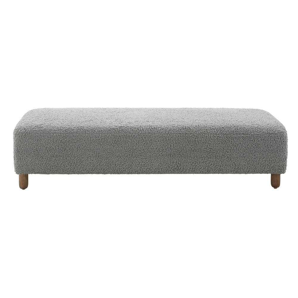 Side view of grey fabric rectangular ottoman