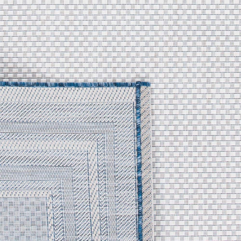 Ivory and Navy Rectangular Synthetic Indoor/Outdoor Rug