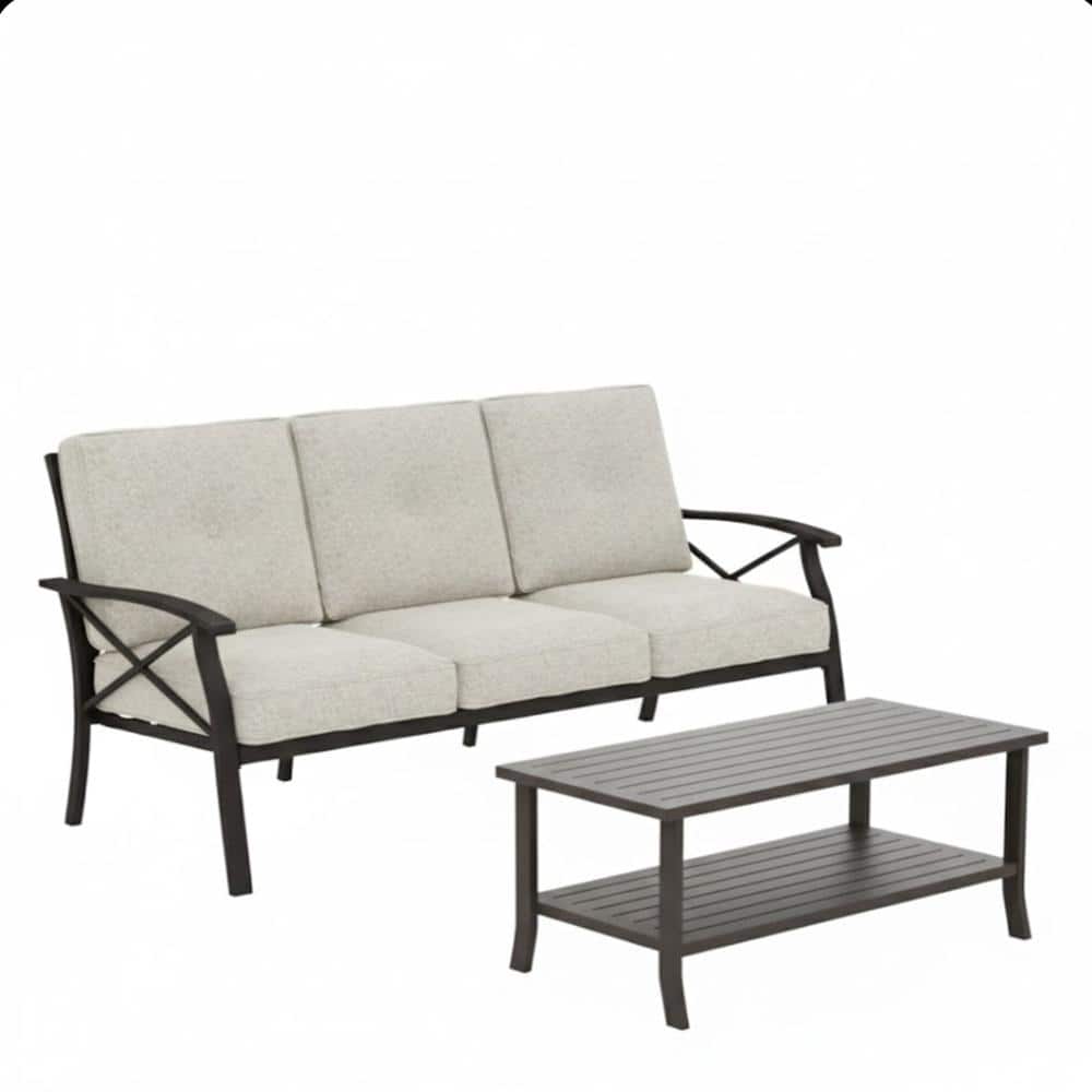 Outdoor metal patio sofa set with beige cushions and coffee table on white background.