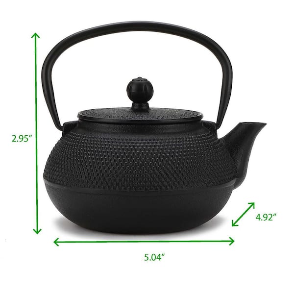 cast iron teapot on stove top