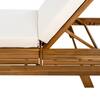Close-up of the wooden frame and white cushion of the chair.