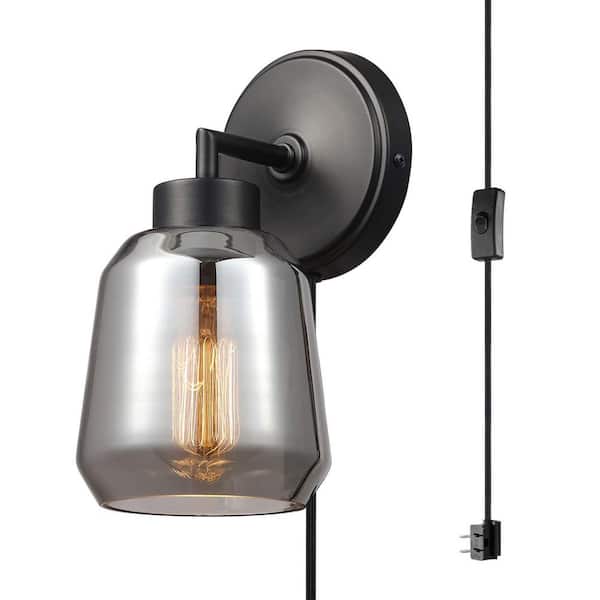 Globe Electric Salma 1-Light Matte Black Plug-In or Hardwired Wall Sconce with Plated Smoked Mirror Glass Shade