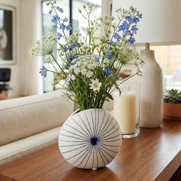 Liv & Skye 4 in. White/Blue Ceramic Round Dotted Shell Decorative Vase