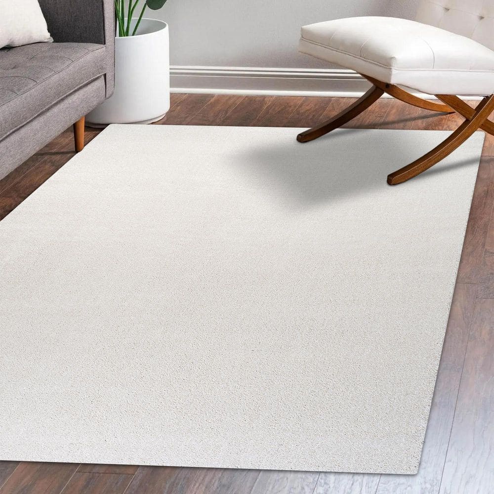 Cream Solid Synthetic Low-Pile Reversible Area Rug 8 x 10