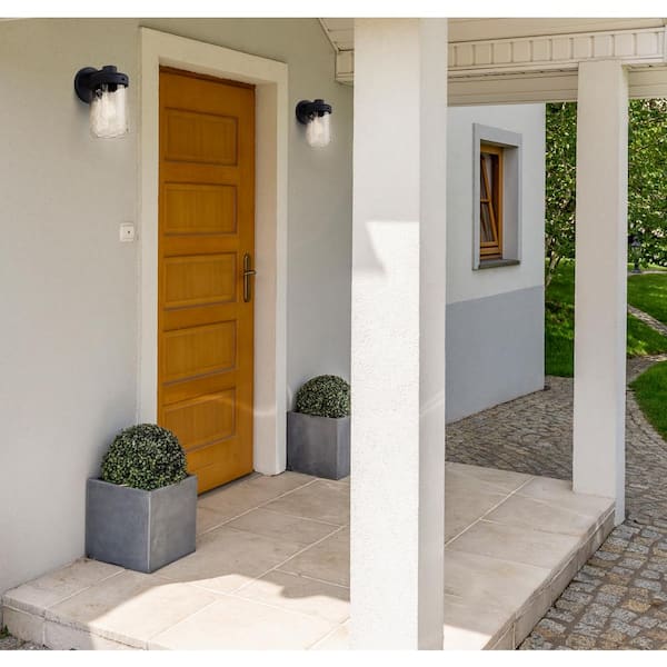 Juno 10.25 in. Black Outdoor Hardwired Wall Sconce with No Bulbs Included and Clear Textured Glass