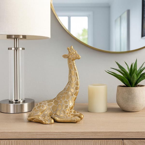 Liv & Skye Gold 8 in. x 10 in. Resin Sitting Giraffe Figurine