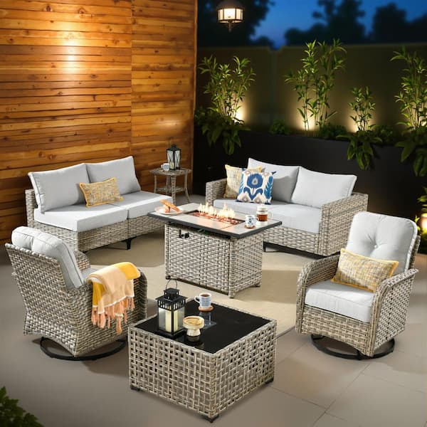 XIZZI Enchanted 9 Pieces Wicker Outdoor Patio Rectangular Fire Pit Set and Swivel Rocking Chairs with Gray Cushions