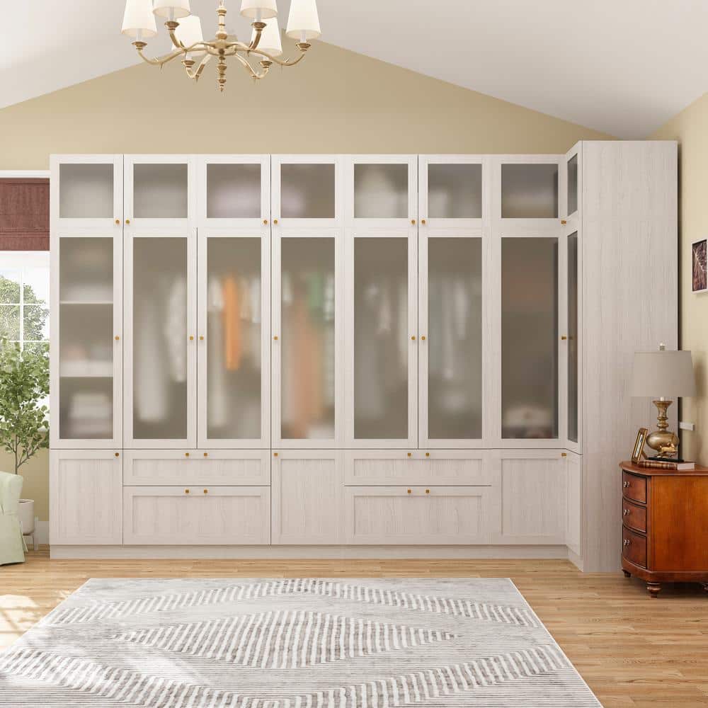 Full view of the beige wood wardrobe with tempered glass doors and drawers.