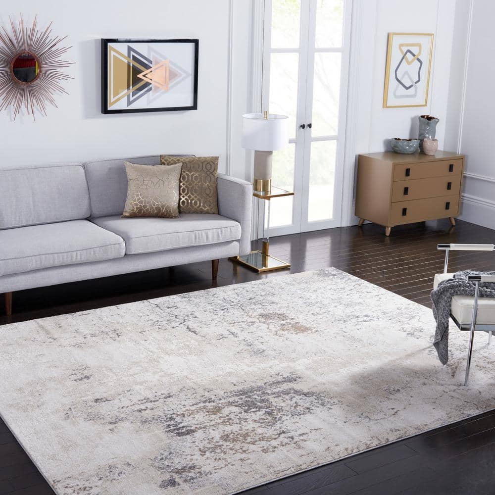 Ivory and Grey Abstract 8' x 10' Synthetic Area Rug