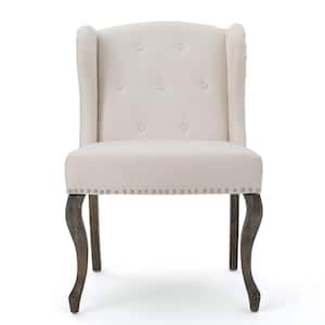 Niclas Button Back Beige Fabric Winged Chair with Stud Accents
