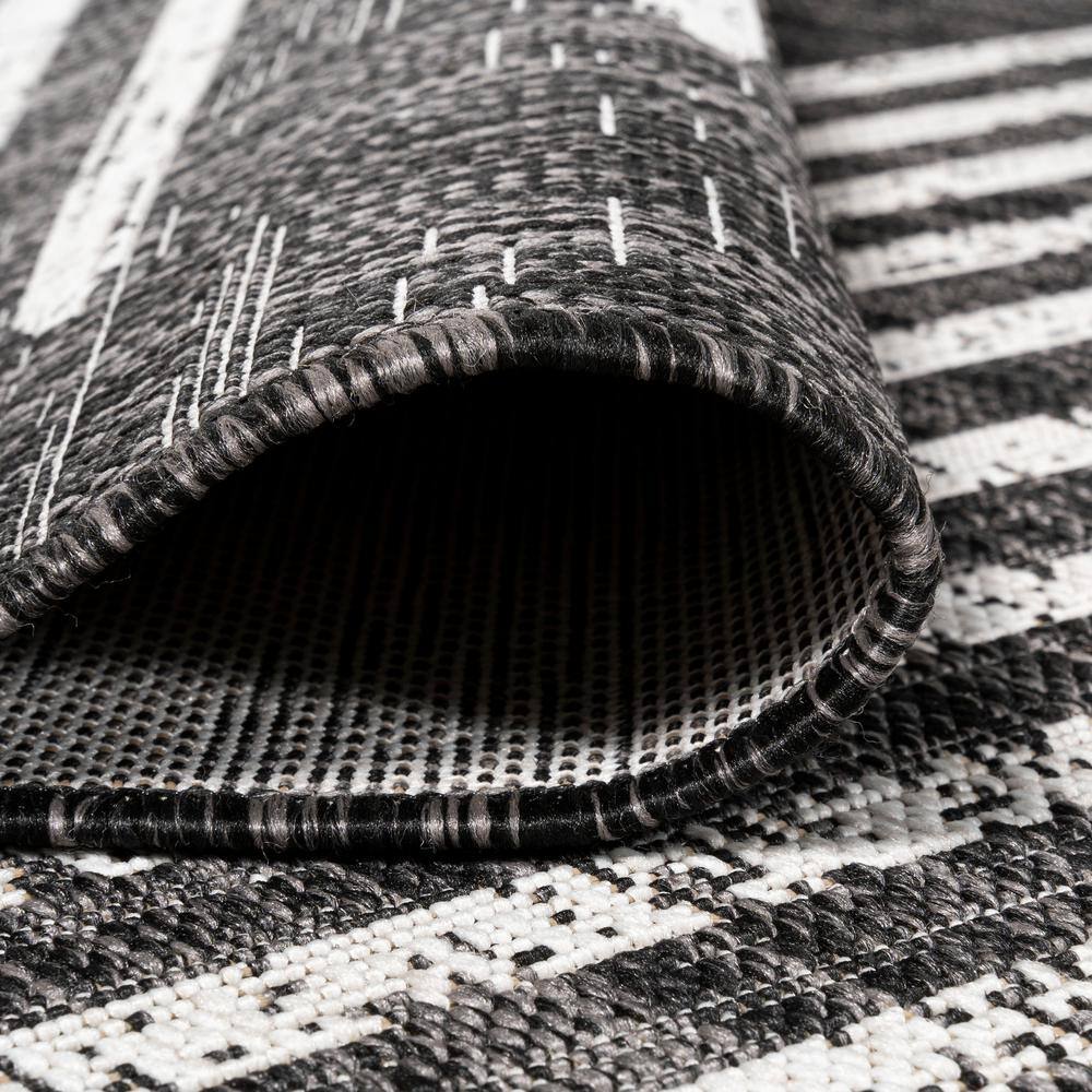 Zolak 4' x 6' Black and Ivory Synthetic Stripe Rug