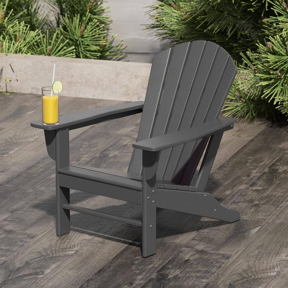 Gray Adirondack chair outdoors on a wooden deck.