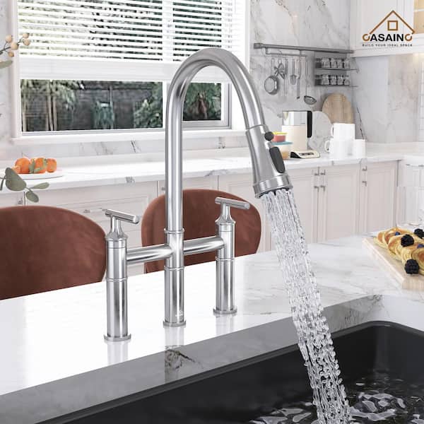 Double Handle Bridge Kitchen Faucet with Three Function Pull-Down Sprayhead in Brushed Nickel