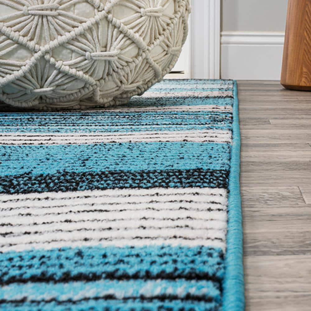 5' x 8' Blue and Navy Gradient Striped Synthetic Area Rug