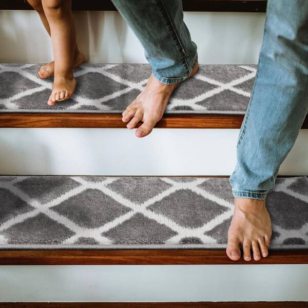 https://images.thdstatic.com/productImages/593154fb-9adb-4e46-8ef6-9f67a81751b1/svn/gray-the-sofia-rugs-stair-tread-covers-stair-64b-gr-15-e1_600.jpg