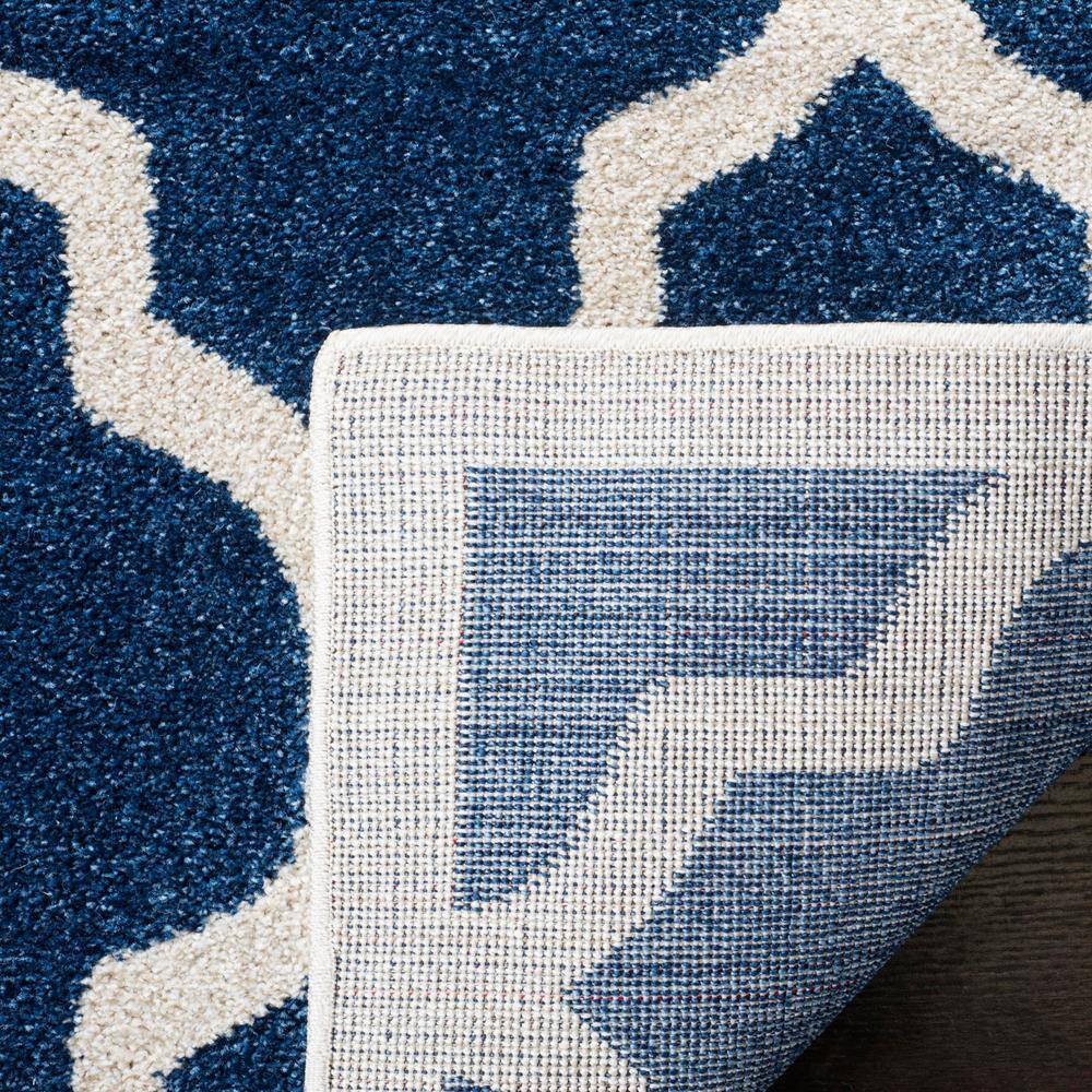 Reversible Geometric Navy and Beige 5' x 8' Synthetic Area Rug