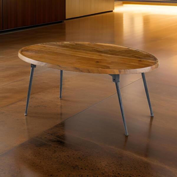 Benjara Aji 21 in. Brown Black Oval Acacia Wood Top Coffee Table with Iron Legs