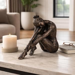 Liv & Skye Bronze 9 in. x 8 in. Resin Textured Sitting Man