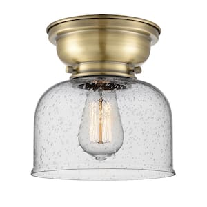 Bell 8 in. 1-Light Antique Brass Flush Mount with Seedy Glass Shade