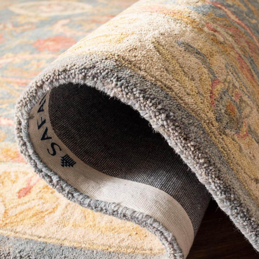 Handmade Light Blue and Ivory Floral Wool 6' x 9' Area Rug