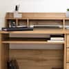 Desk organized with stationery and books.