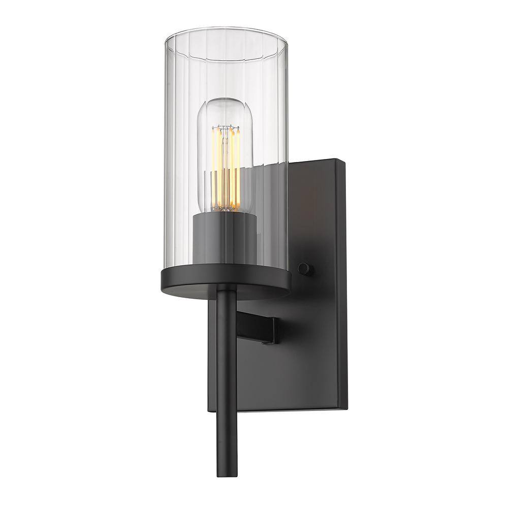 https://images.thdstatic.com/productImages/598c216a-f415-4a4a-8f0d-3c89887f2b9f/svn/matte-black-golden-lighting-vanity-lighting-7011-1w-blk-clr-64_1000.jpg