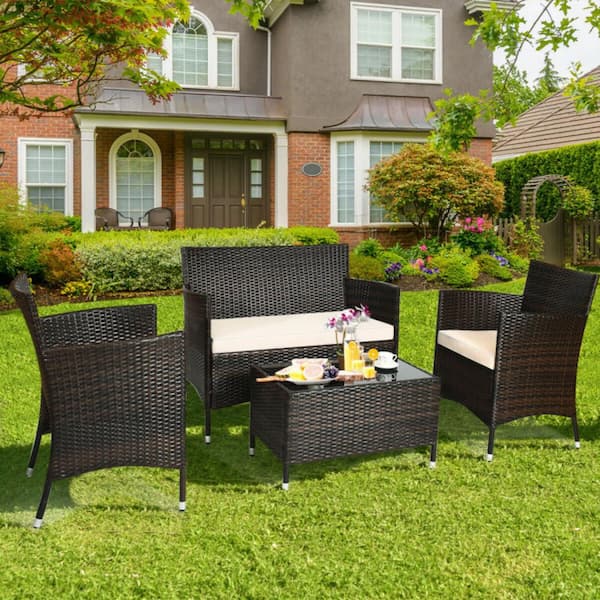 Clihome 4 Pieces Wicker Outdoor Patio Conversation Set Rattan Sofa Set with CushionGuard Beige Cushions and Glass Table CWCH HW63214 The Home Depot