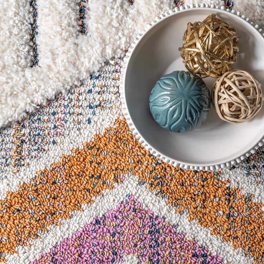 Ivory Geometric Synthetic Rectangular Area Rug with Braided Tassels