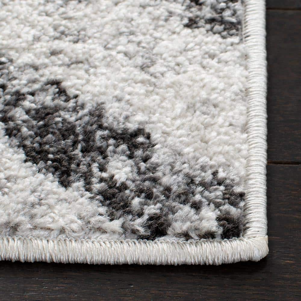 Ivory and Grey Geometric 8' x 10' Synthetic Area Rug