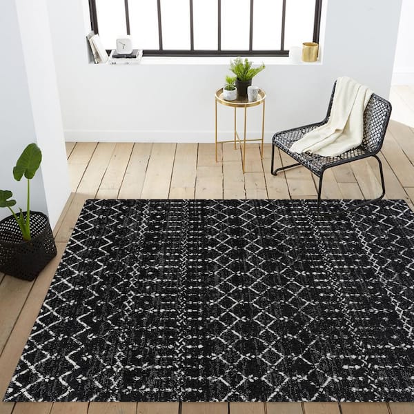 https://images.thdstatic.com/productImages/5a1032ee-537f-4ad3-91ff-ef5ca10b40a3/svn/black-ivory-jonathan-y-area-rugs-moh101d-3-40_600.jpg