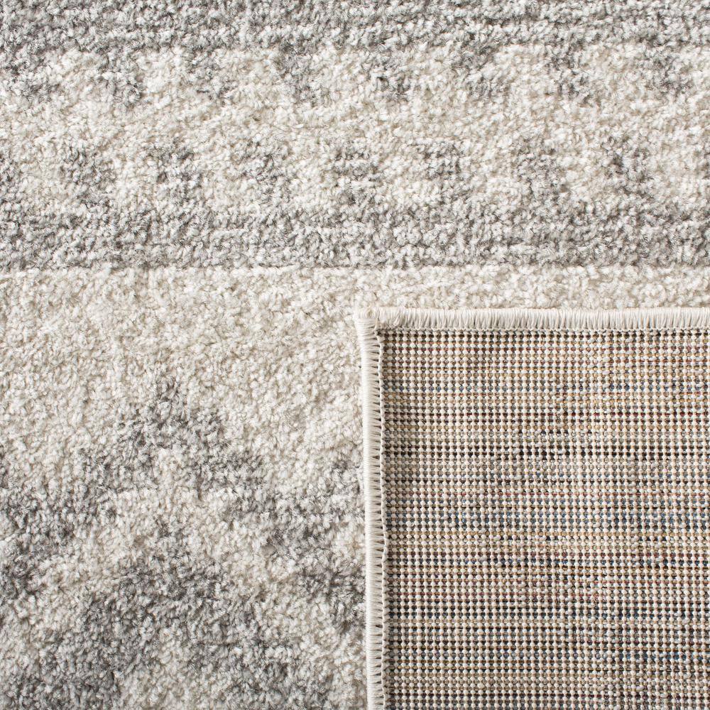 Chic Ivory & Silver Synthetic 10' x 14' Easy-Care Area Rug