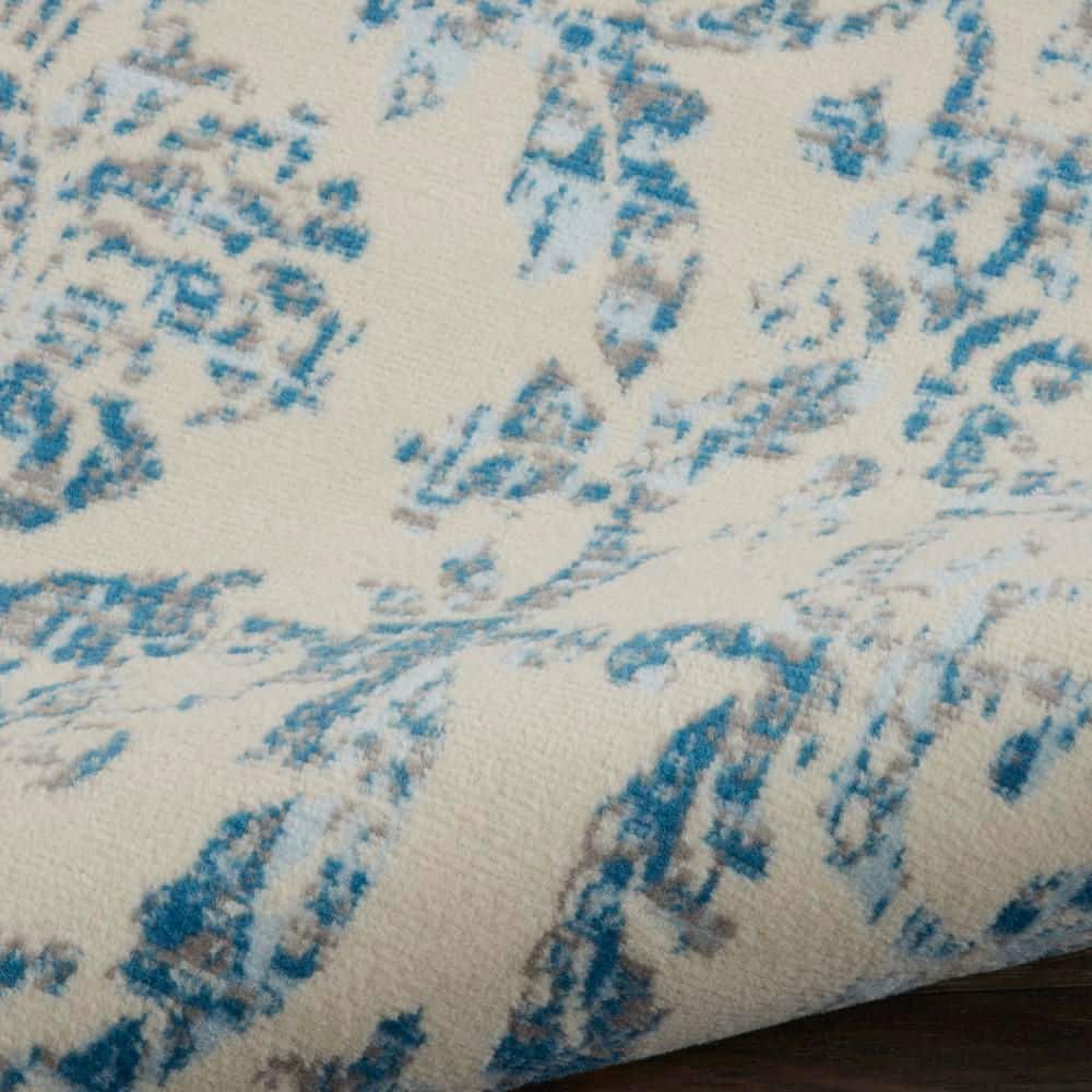 Elegant Ivory and Blue Damask 7' x 10' Synthetic Area Rug