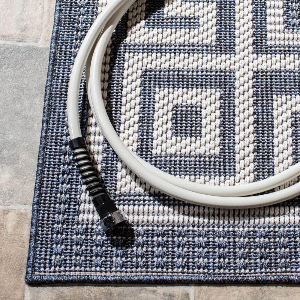 Dark Blue and Ivory Geometric 8' x 10' Synthetic Area Rug