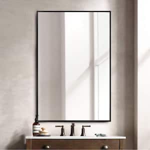 26 in. W x 38 in. H Rectangular Metal Framed Bathroom Wall Mirror in Black