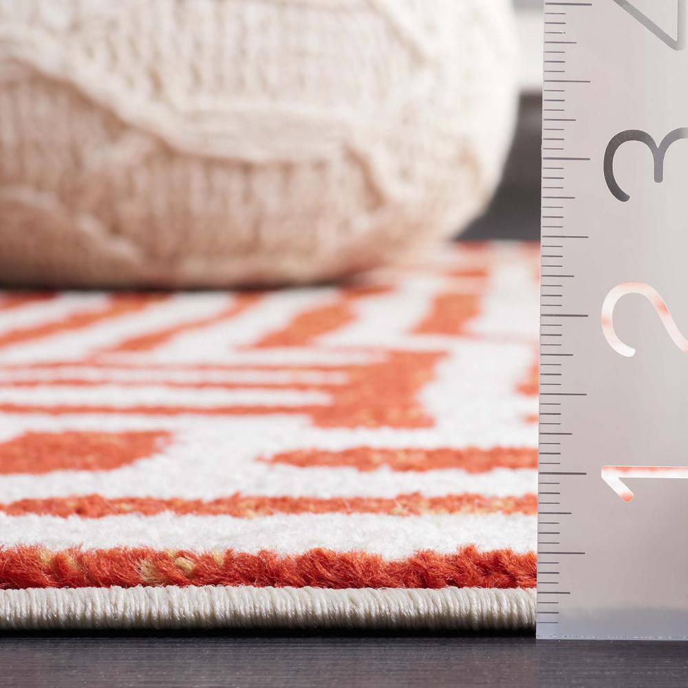 Ivory and Terracotta Geometric Synthetic Area Rug