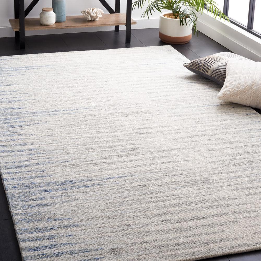 Handmade Abstract Ivory and Light Blue Wool Area Rug, 4' x 6'