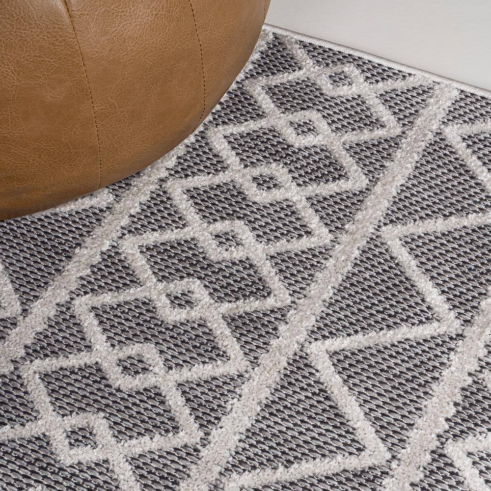 Aylan Black/Ivory Geometric High-Low Pile Synthetic Indoor/Outdoor Rug