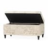 Open beige linen storage bench showing the interior compartment.