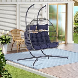 2 Person 720 lbs. Outdoor Rattan Hanging Metal Patio Chair Wicker Egg Chair with Black Stand and Dark Blue Cushions