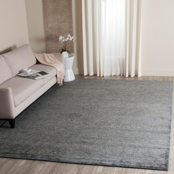 Tibetan 9 ft. x 12 ft. Black Solid Color Area Rug