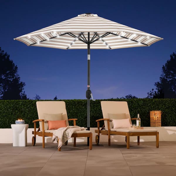 black and tan striped patio umbrella Business & Pleasure Co. The Resort Market x Jenni Kayne Umbrella Stand and weights sold separately. Best Choice Products 10ft Solar