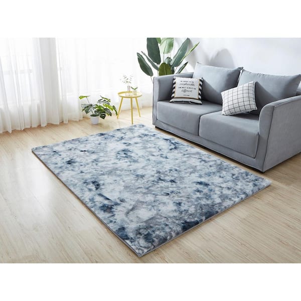 https://images.thdstatic.com/productImages/5b45245a-5503-46ac-95e3-18905d5f0c21/svn/gray-tie-dye-nube-area-rugs-rsrtdgr1219-57-e1_600.jpg